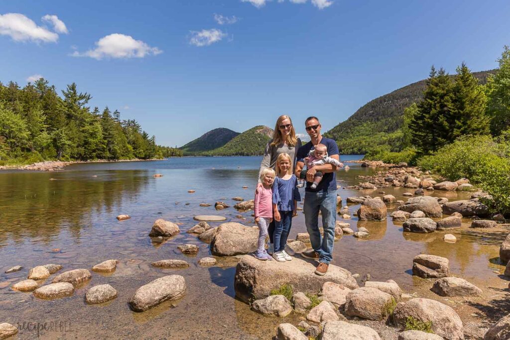 family photo at jordan pond standing on rocks in the water