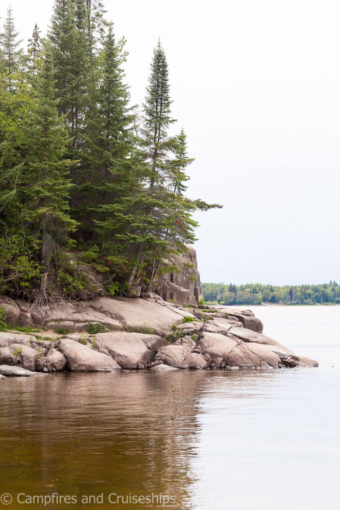 rocky edge of the beach at nutimik lake and campground in manitoba canada