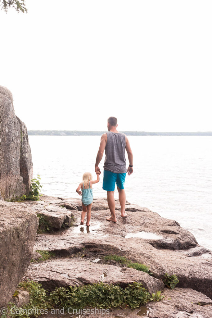 rocks at blueberry hill at nutimik lake in manitoba canada with father and daughter